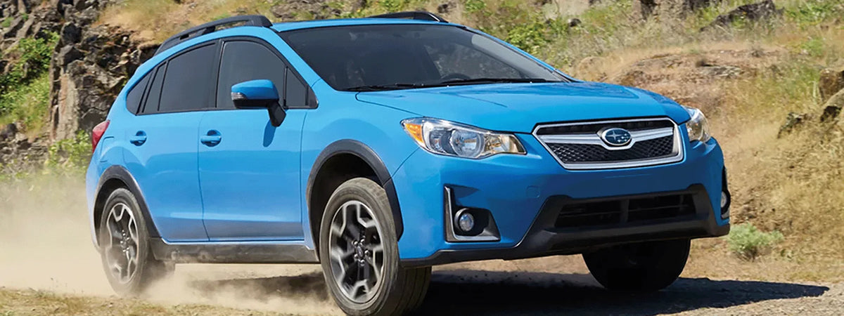 2013 to 2017 Subaru Crosstrek XV with roof rack on forest service road