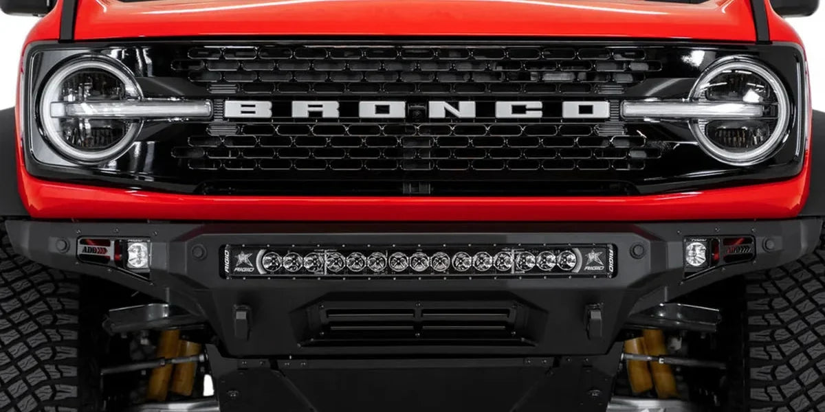 Red Ford Bronco with an ADD Stealth Fighter front bumper and light bar