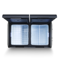 Dual zone portable camping fridge freezer with open lids, interior lighting, wire baskets