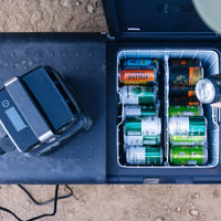 Outdoor portable fridge with assorted cans for camping and overlanding