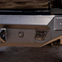 Close-up of a vehicle bumper with metallic finish
