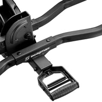Close-up of a black bike pedal with 'Swagman' branding on a white background
