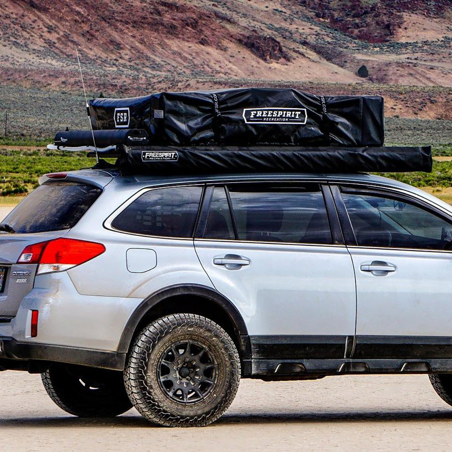 offroad subaru outback with rooftop tent