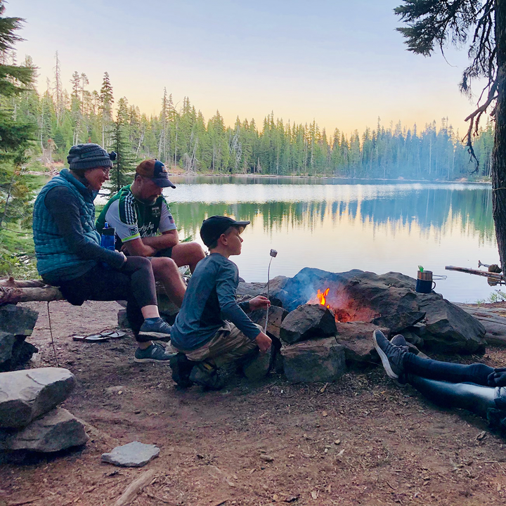 Camp by Lake roasting marshmallows