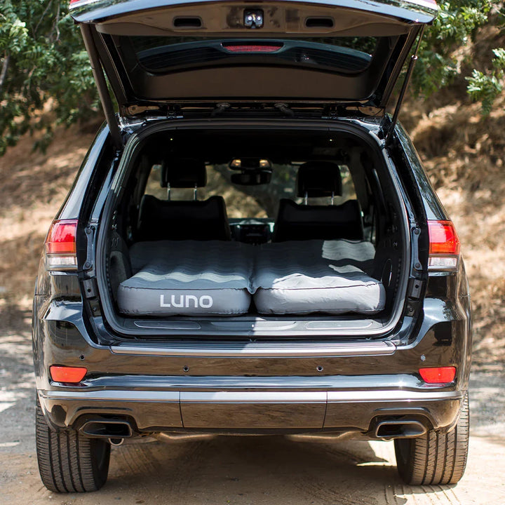 Jeep Grand Cherokee rear hatch open with Luno car camping mattress