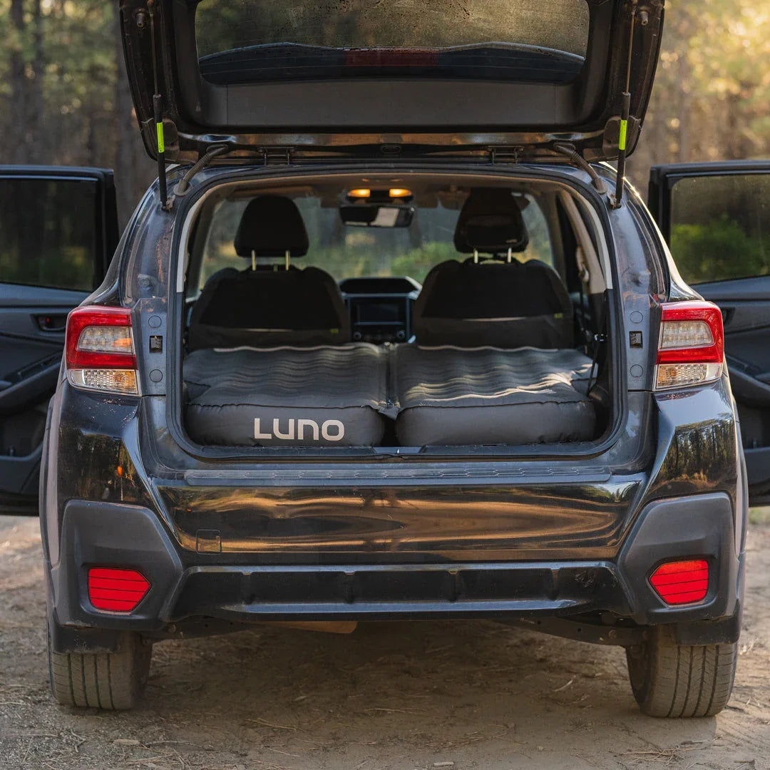 Luno AIR Pro S1 air mattress set up in the back of a Subaru Crosstrek with the rear hatch open