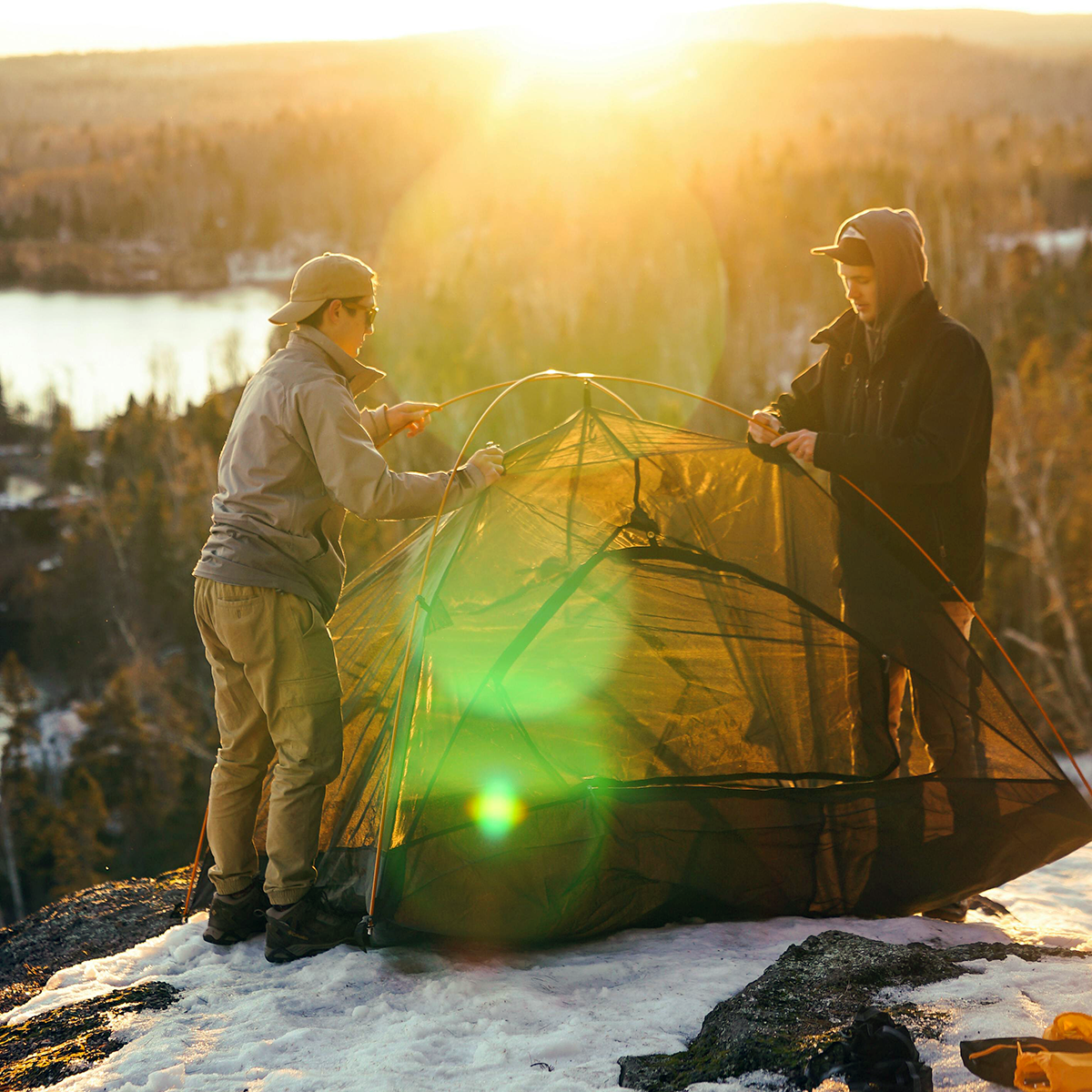 Pitching tent in snow