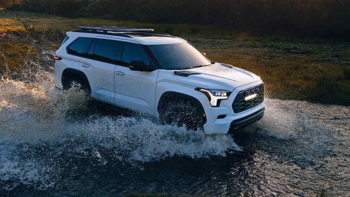 White Toyota Sequoia TRDPro running through water