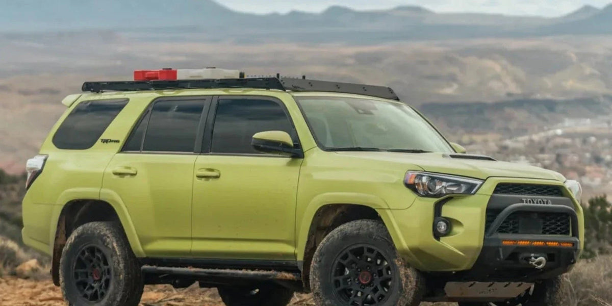 Green Toyota 4Runner with a CBI Covert front bumper parked on a desert trail