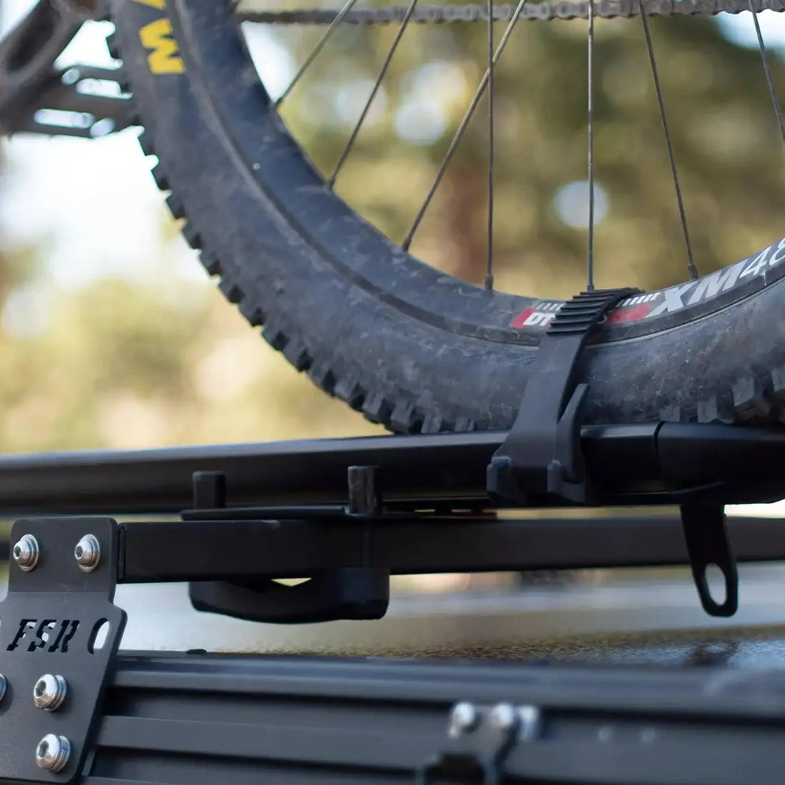 Free Spirit hard shell rooftop tent crossbars in use with gear