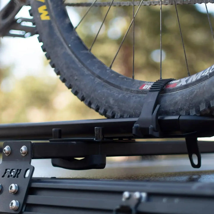 Free Spirit hard shell rooftop tent crossbars in use with gear