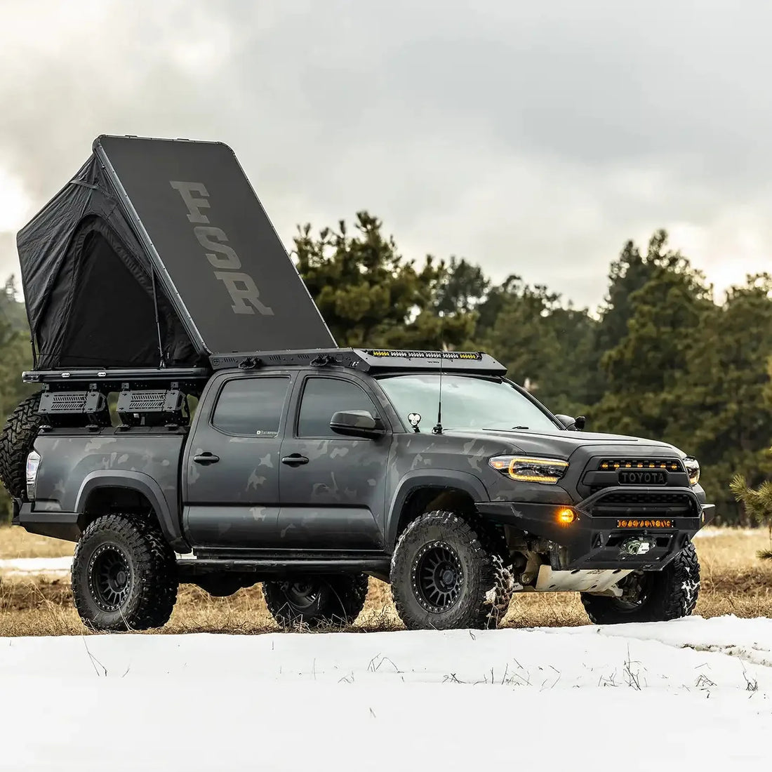 Free Spirit Aspen Lite XL rooftop tent in use at camp