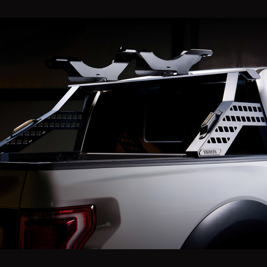 Two mountain bikes standing in a pickup bed on Big Days bike trays