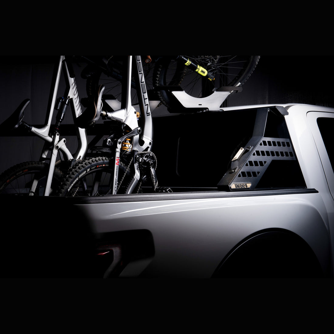 Chase Rack System holding mountain bikes vertically with tailgate closed