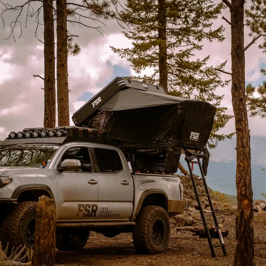 Free Spirit Kali rooftop tent installed on a Tacoma bed rack