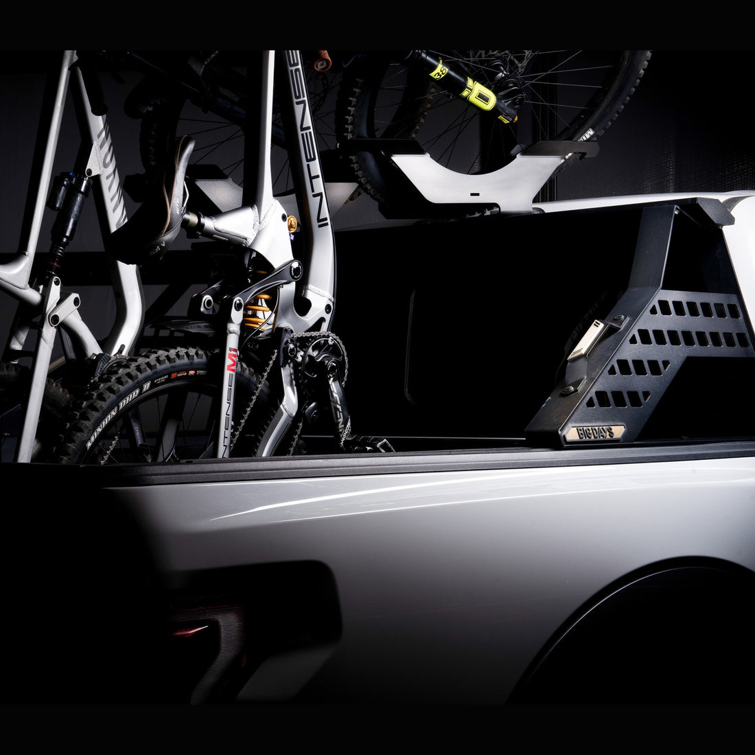 Chase Rack System holding mountain bikes vertically with tailgate closed