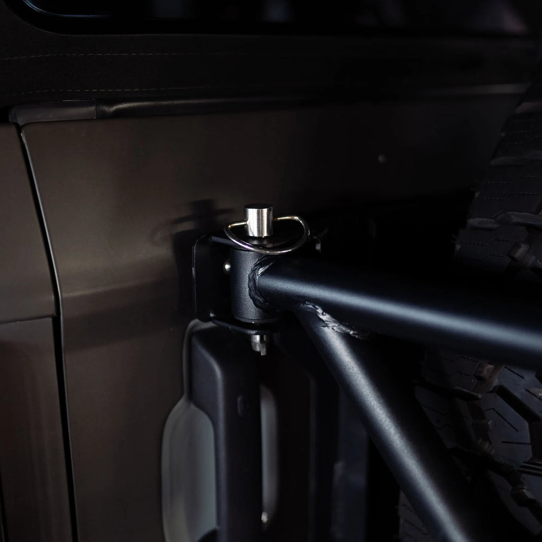 Close-up of the DV8 Offroad spare tire guard tailgate reinforcement for 6th Gen Ford Bronco