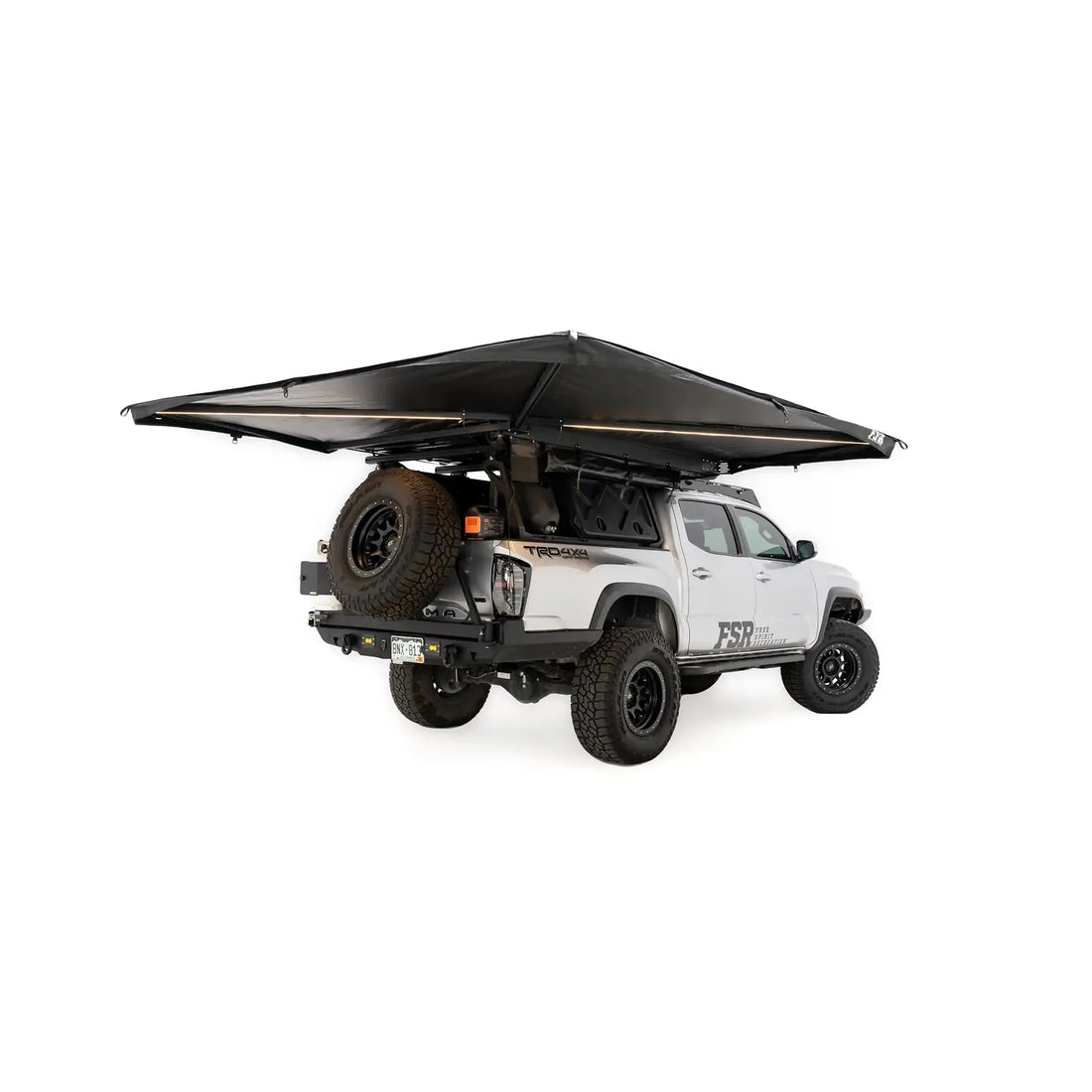 Free Spirit 270 Awning V2 fully open with integrated LED arms on a Tacoma