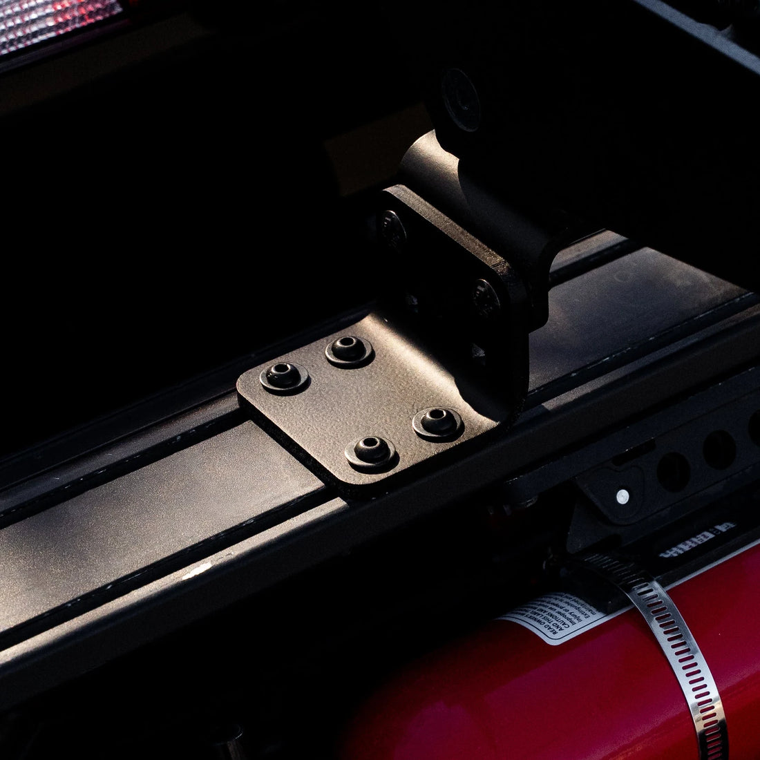 Moto offset kit installed on Chase Rack T-track under a dirt bike mount