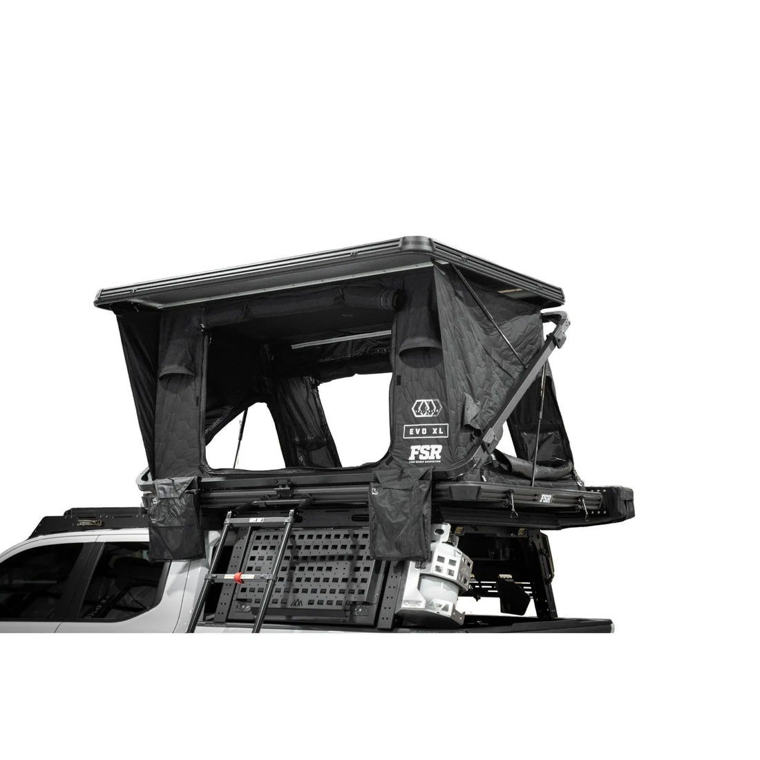 Free Spirit Evolution XL hard shell rooftop tent open on a truck bed rack
