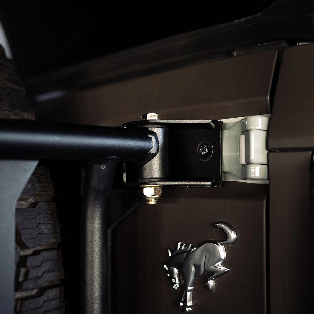 Close-up of DV8 Offroad tailgate reinforcement hinge for 6th Gen Ford Bronco