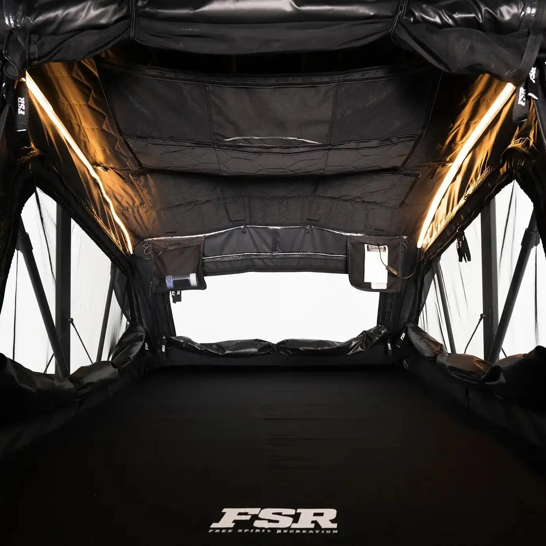 Interior of the Free Spirit Nova Standard rooftop tent with LED lights on