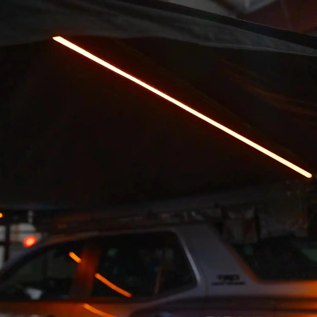 Amber LED light bars on a Free Spirit 270 Awning V2 set to full brightness