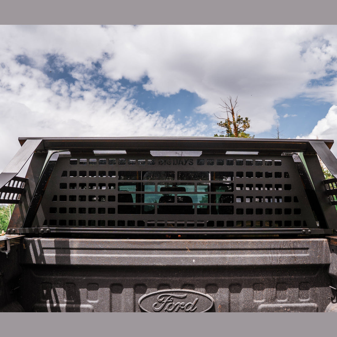 Cab protection plate on a Big Days rack with dirt bikes loaded