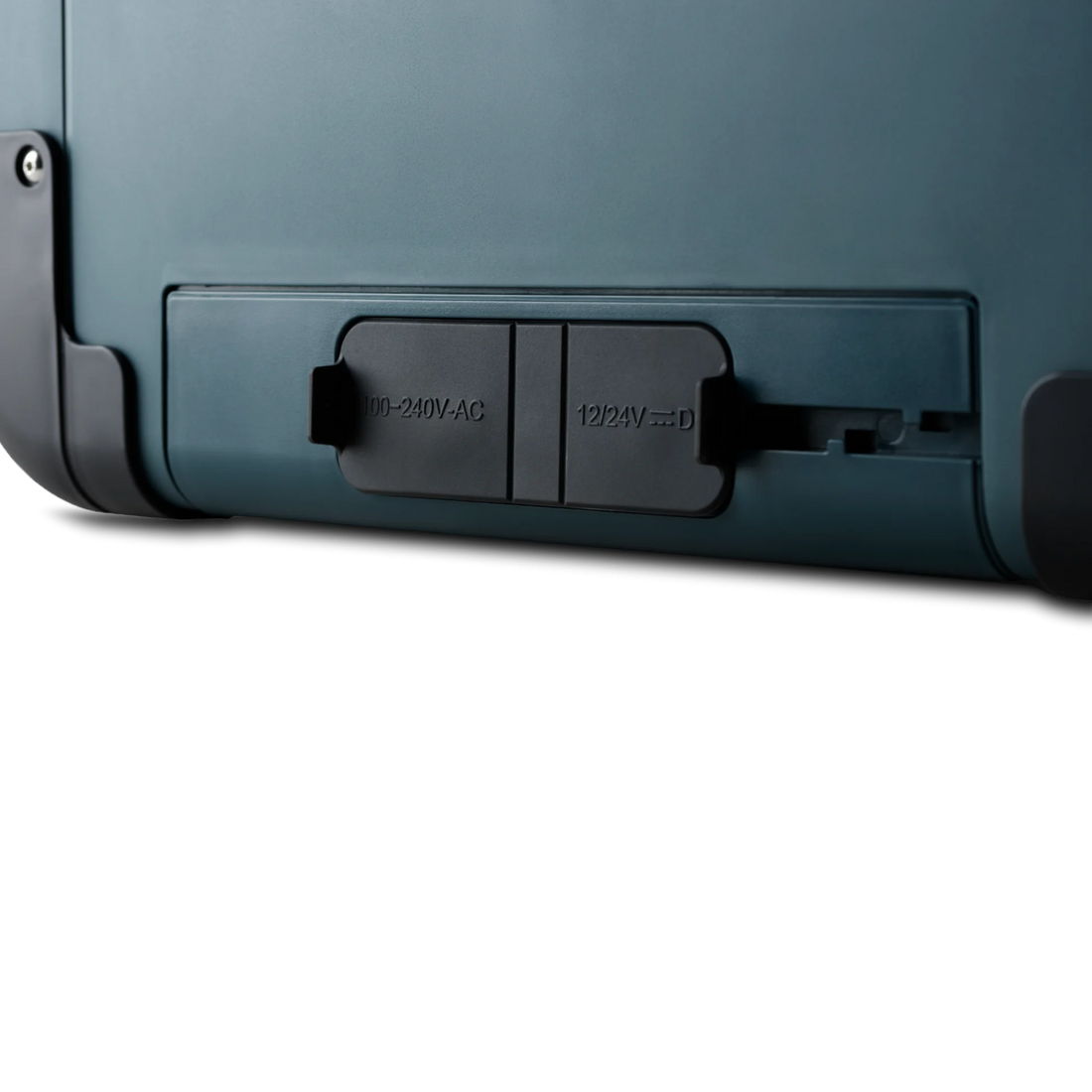 Close-up of outdoor portable fridge power input panel with AC and DC plug covers