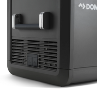 Close-up of a portable outdoor fridge with handle and dual AC/DC power inputs