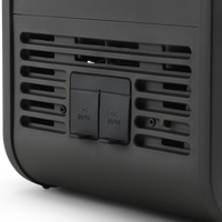 Black electronic device with AC and DC input ports on a white background