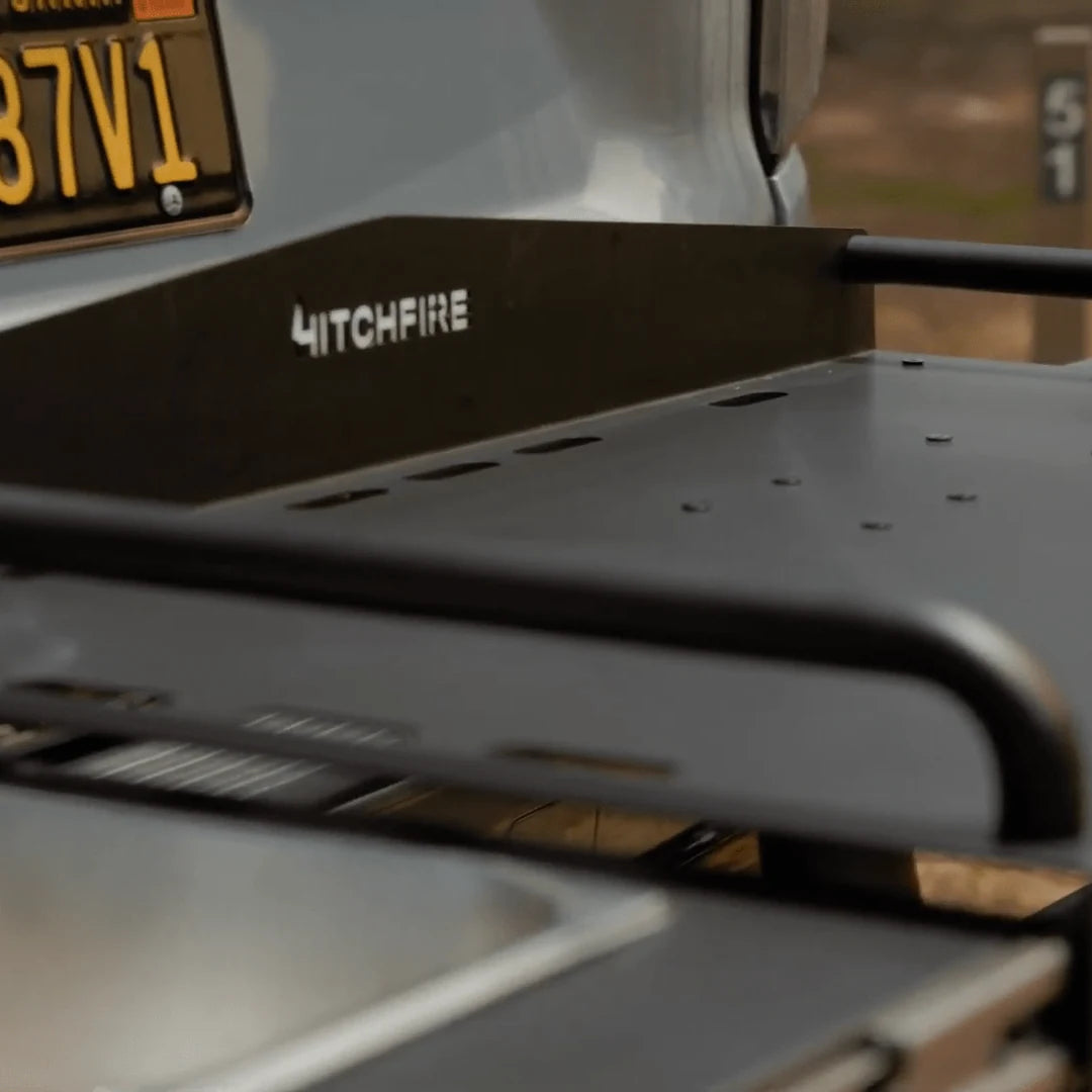 Black HitchFire vehicle accessory on a truck with a blurred background