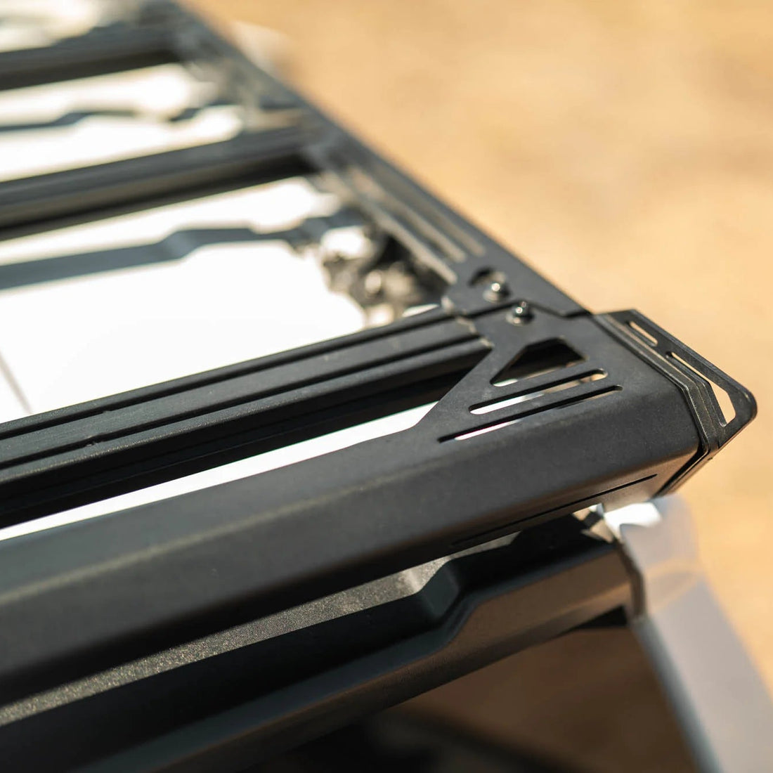 Close-up of a black metal ladder on a blurred background