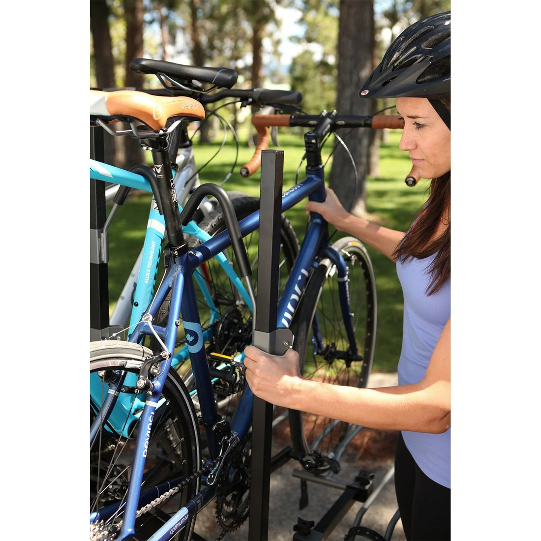Swagman XTC 4 hitch mounted bike rack behind a family vehicle