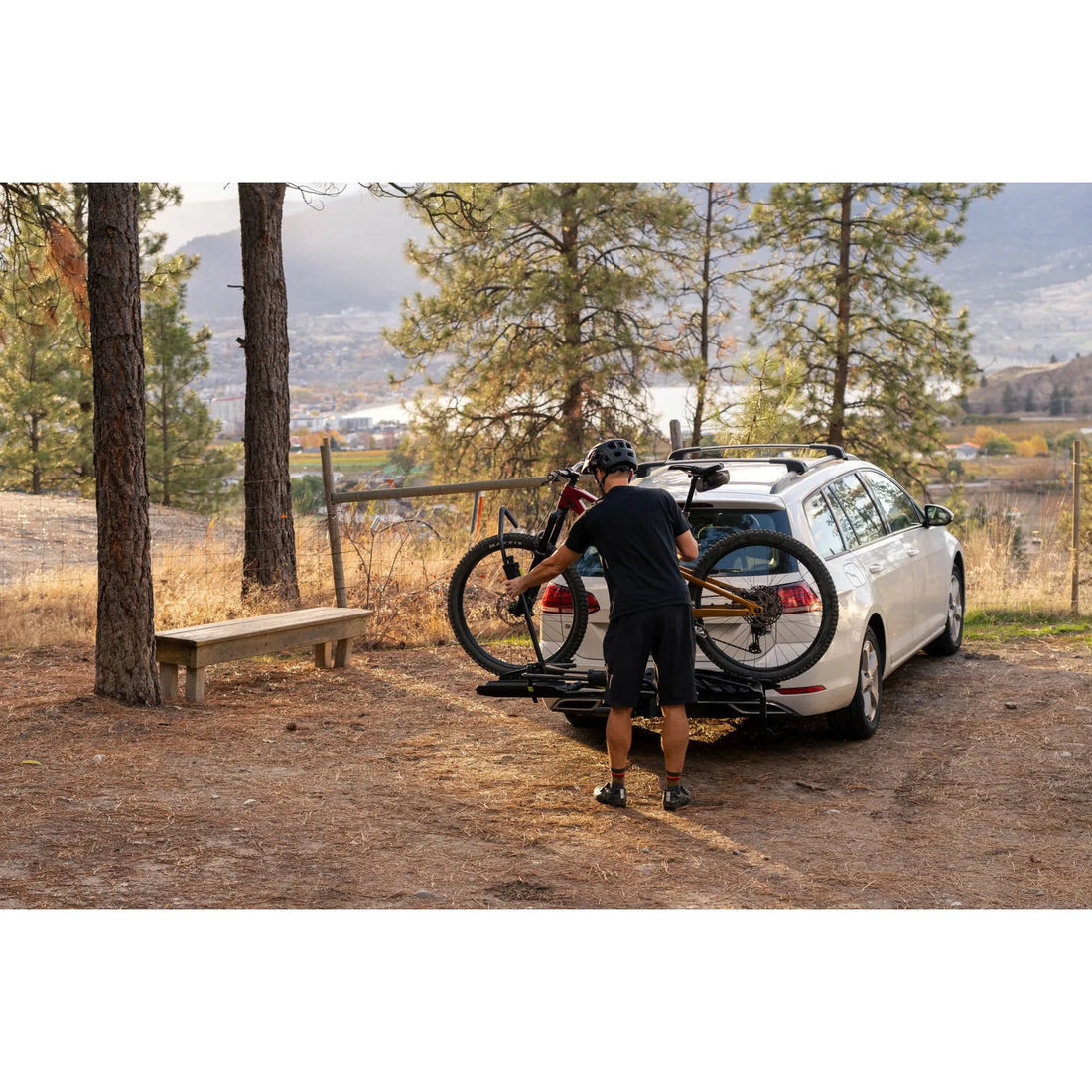 Swagman Escapee Pro hitch rack lifestyle with bikes secured by the wheels