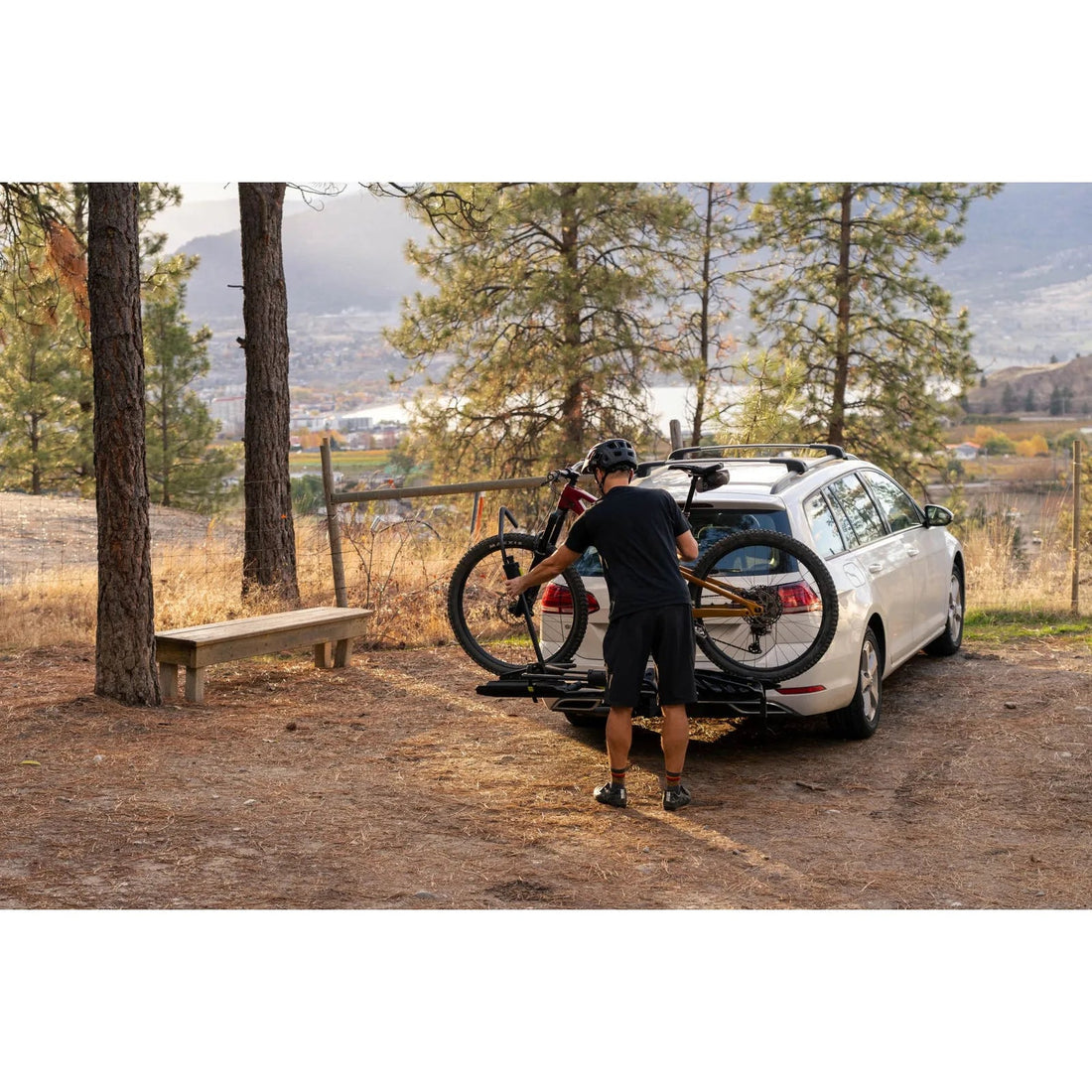 Swagman Escapee Pro hitch rack lifestyle with bikes secured by the wheels