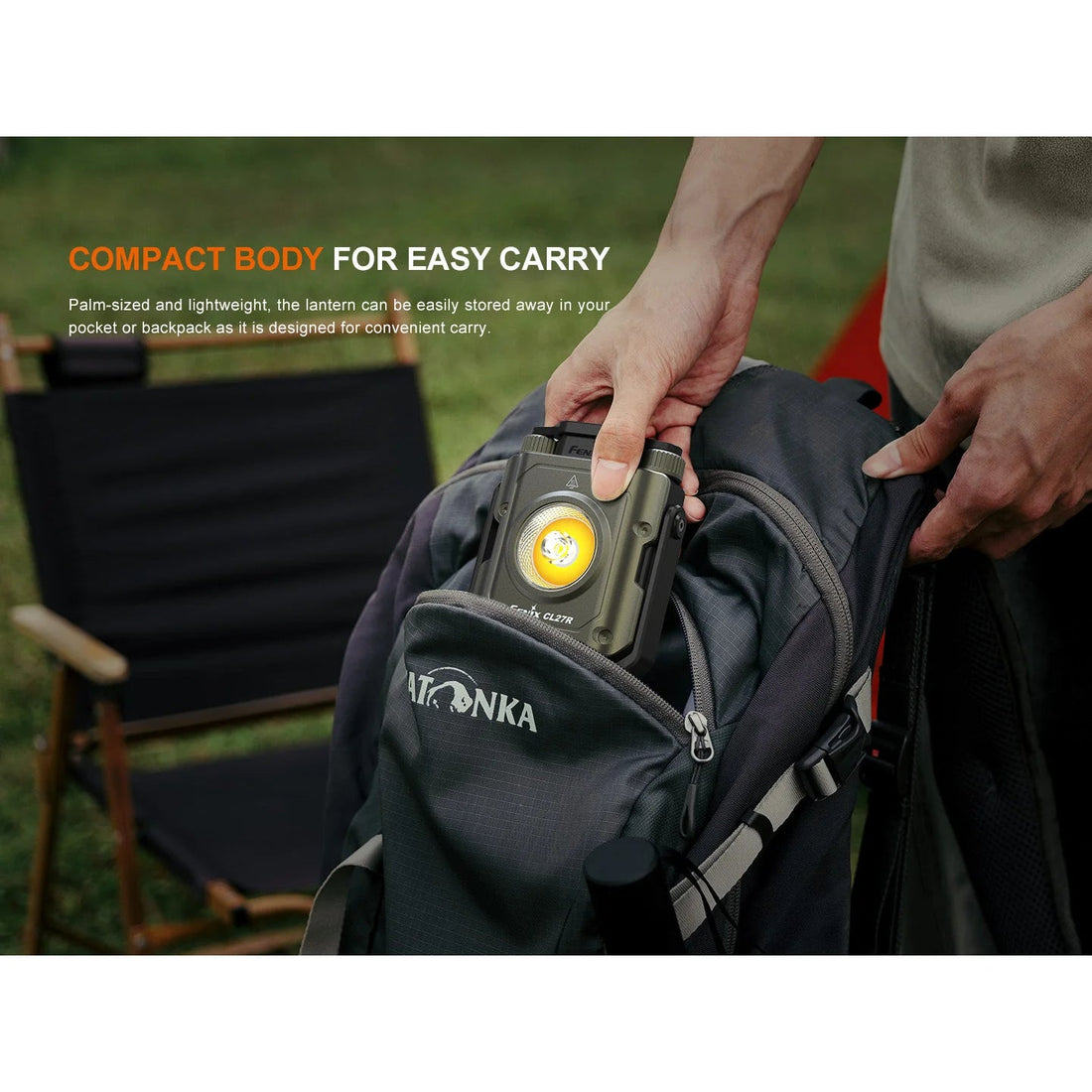 Fenix CL27R lantern carried by its handle at camp