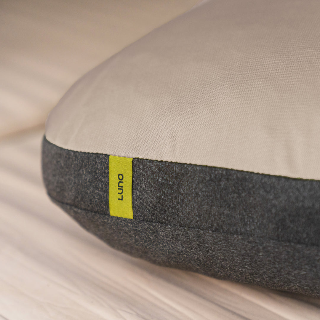 Luno packable pillow close-up, Savannah and Charcoal