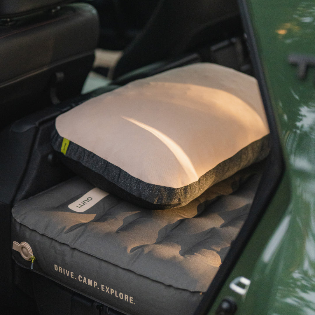 Luno packable camp pillow on a vehicle mattress