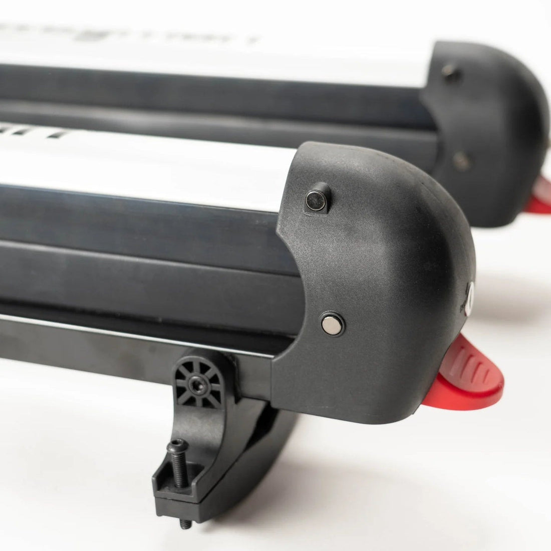Close-up of a Squall4 snowboard rack with red accents on a white background