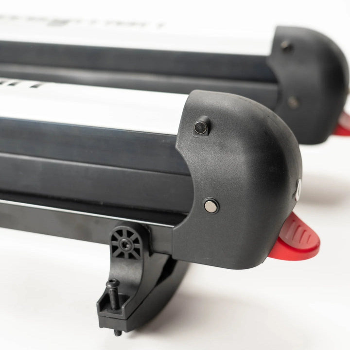 Close-up of a Squall4 snowboard rack with red accents on a white background