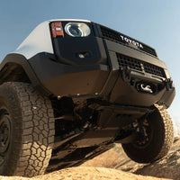 Toyota truck on a dirt road with a clear sky