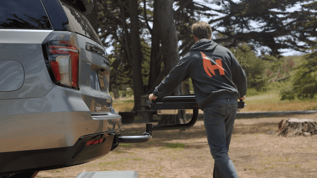 Person interacting with a vehicle in a natural setting