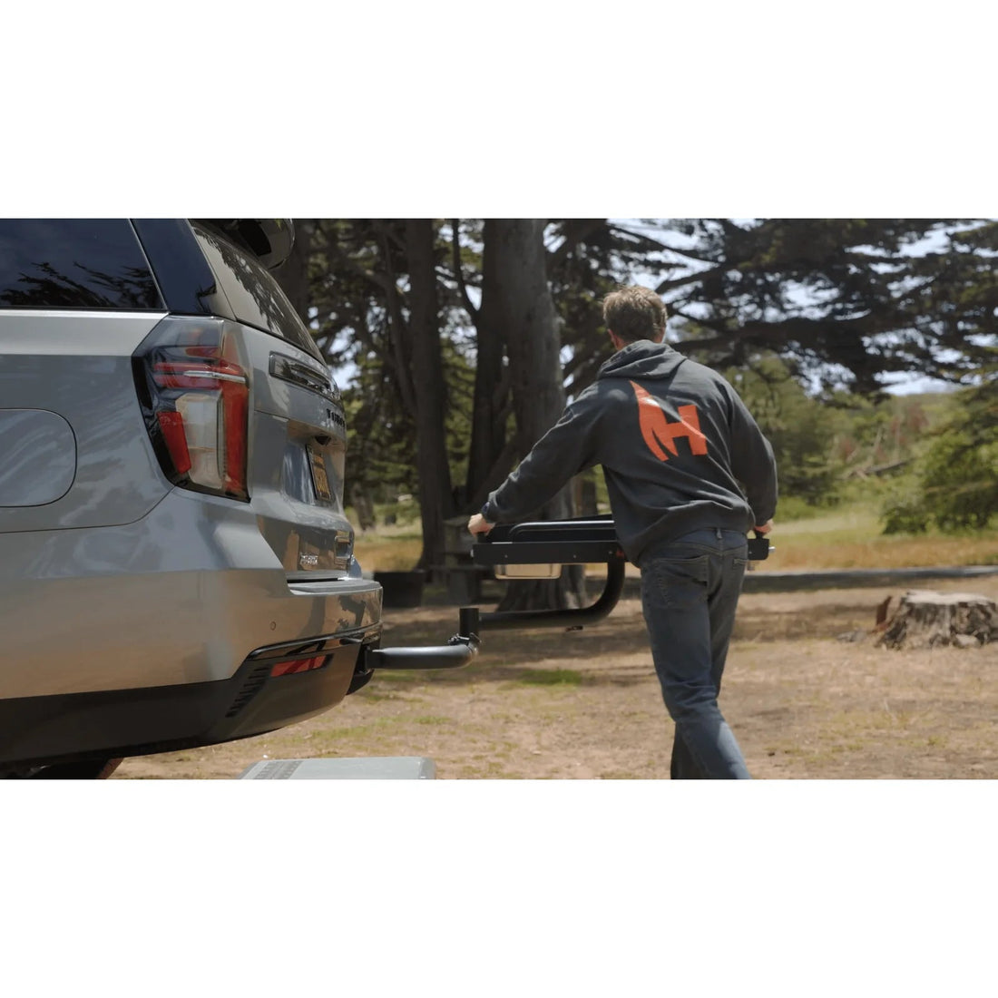 Person interacting with a vehicle in a natural setting