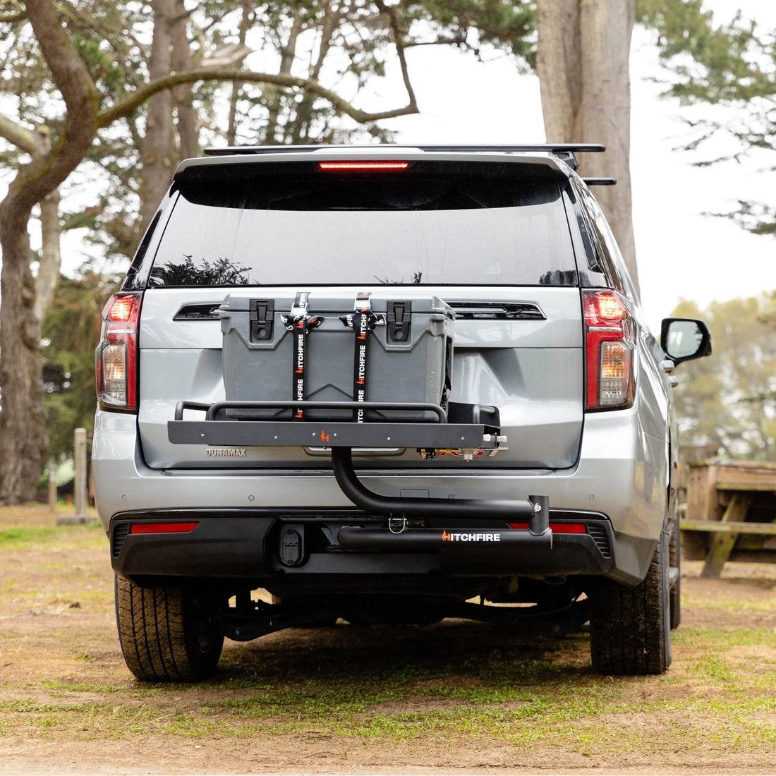 Silver SUV with a hitch receiver attached outdoors