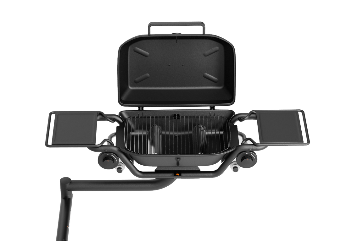 Portable grill with open lid on a transparent background