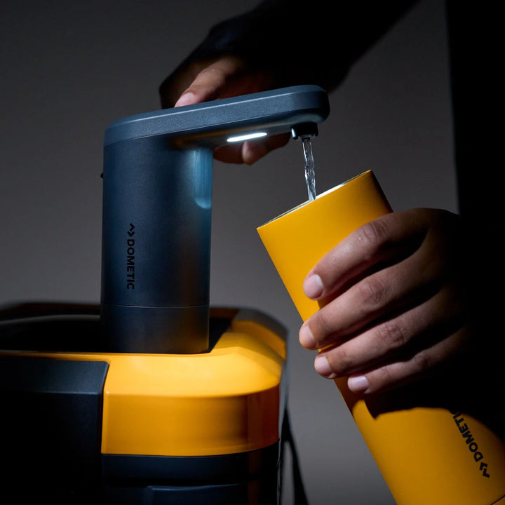 Dometic Recon 360 Faucet filling a bottle at night