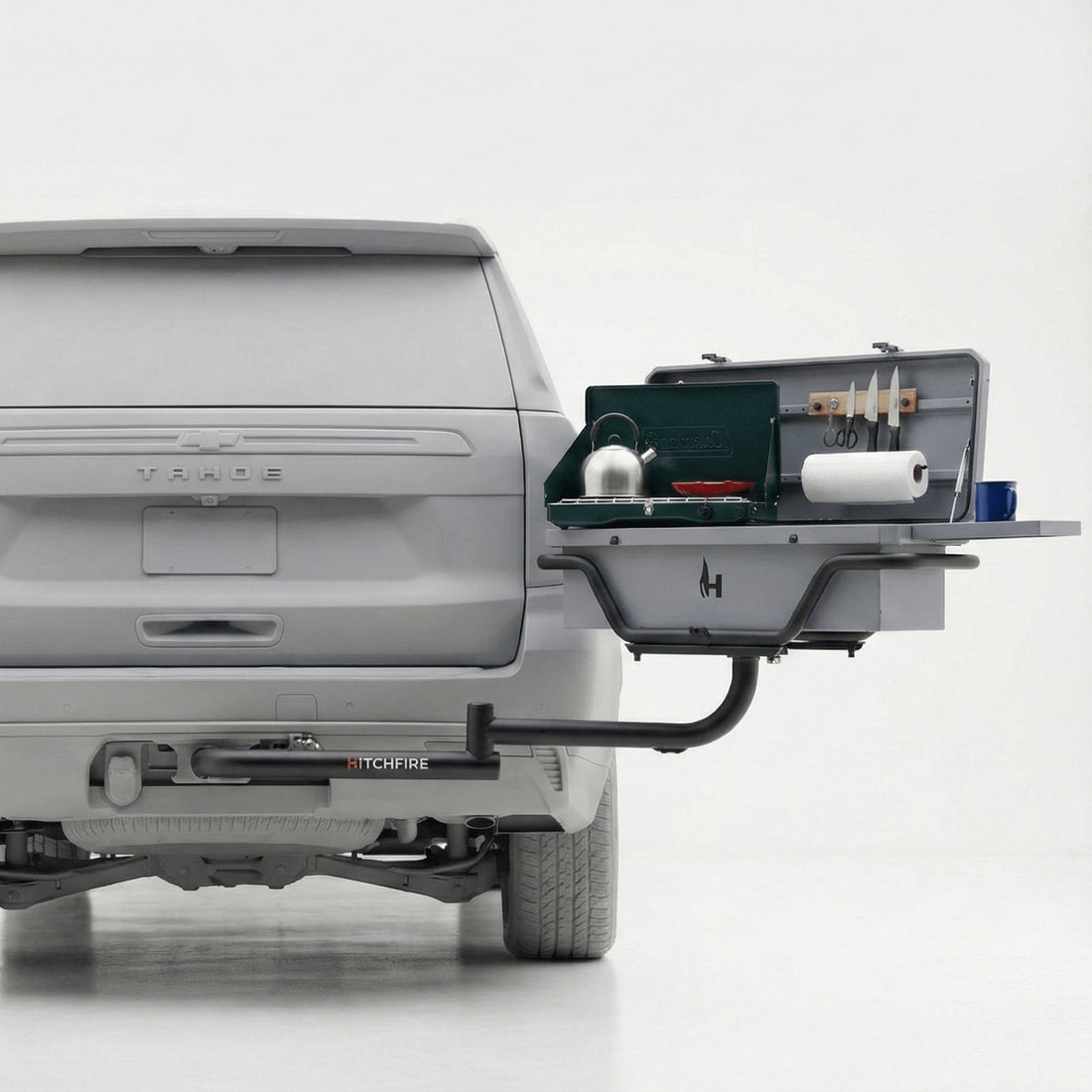 Gray truck with a HitchFire product attached to its hitch on a white background