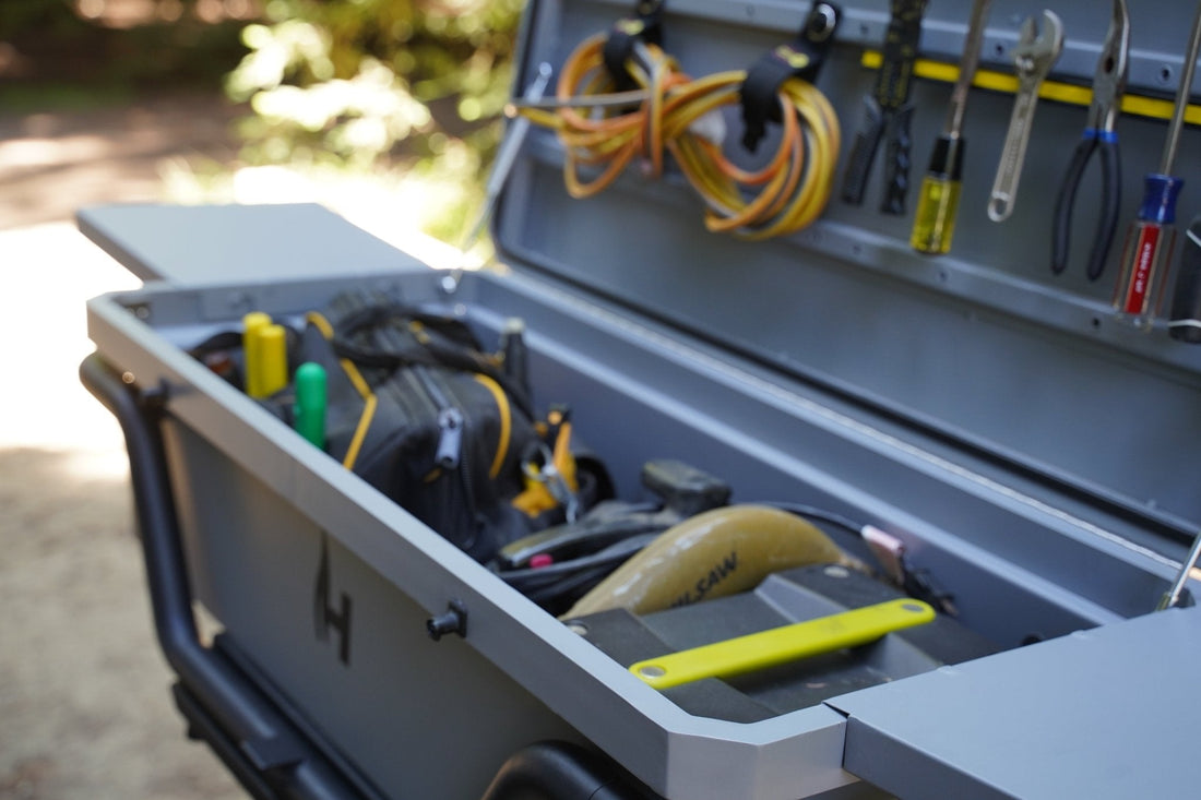 Toolbox with tools and equipment on a blurred outdoor background