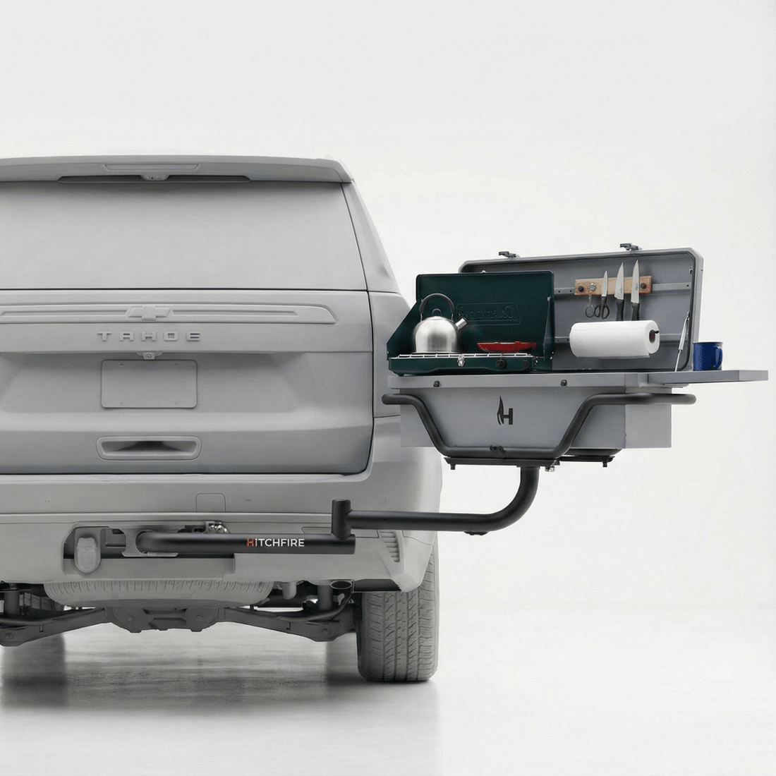 Gray truck with a HitchFire product attached to its hitch on a white background